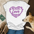 White t-shirt with purple paw prints and "Rescue. Love. Repeat." text.
