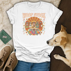 White t-shirt with "WOOF STOCK" text and dogs playing music in a van.