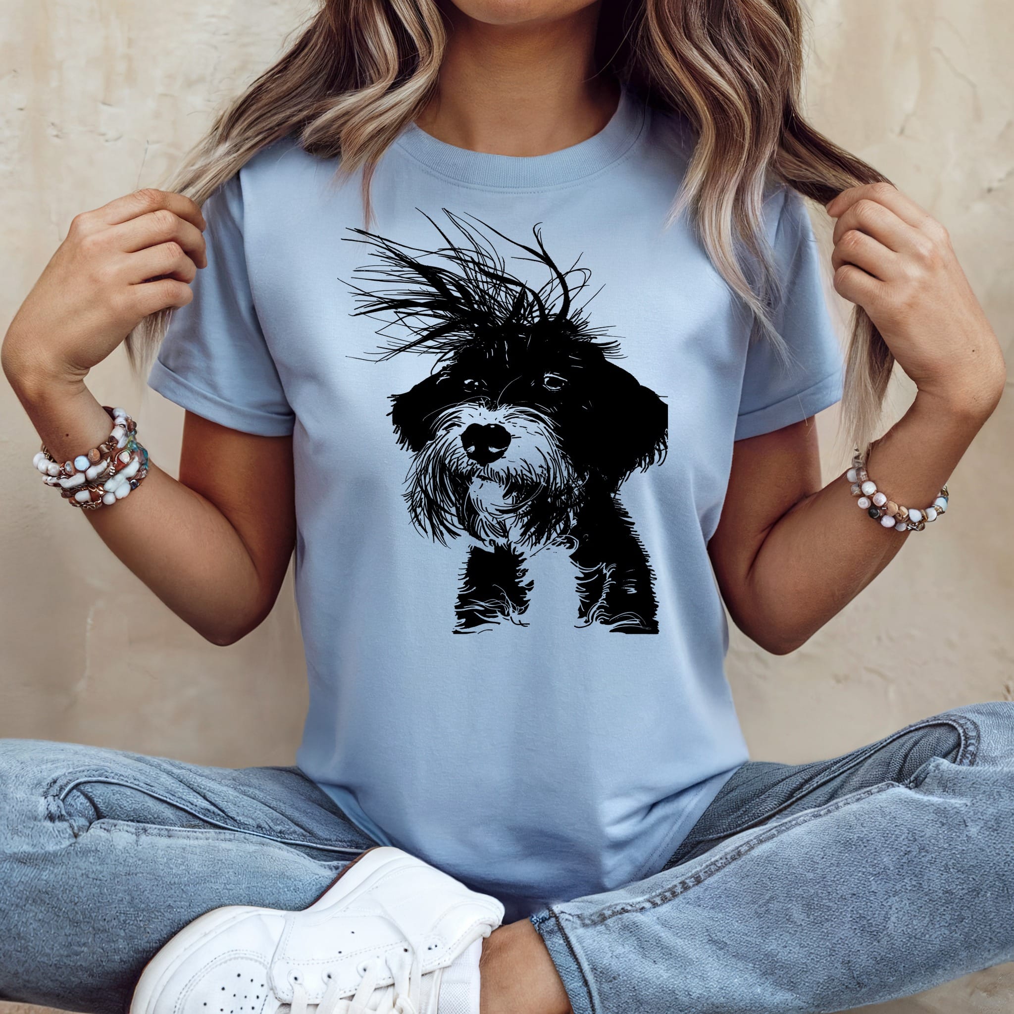 Light blue t-shirt with a black and white scruffy dog graphic print.
