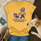 Yellow t-shirt with cartoon man and dog, "The mustache chose us. We are honored."