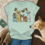 Line of dogs with butterflies above, on a pale blue t-shirt.
