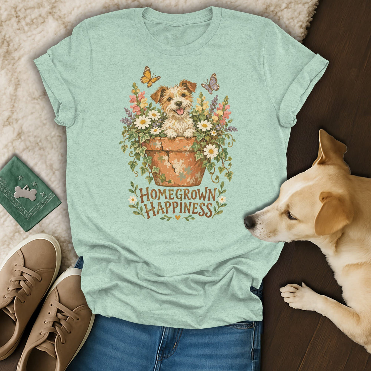 Light green t-shirt with a graphic of a puppy in a flowerpot and the text Homegrown Happiness.