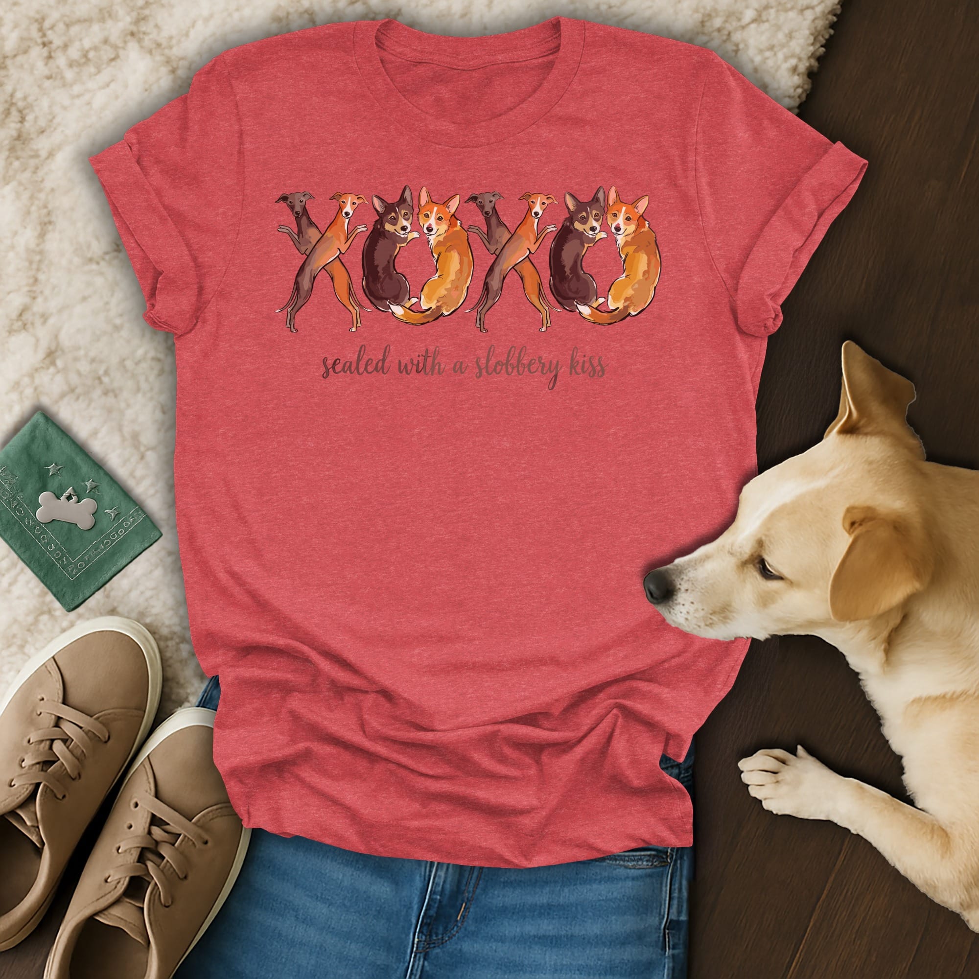 Red t-shirt with playful dogs forming XOXO and "sealed with a slobbery kiss" text.