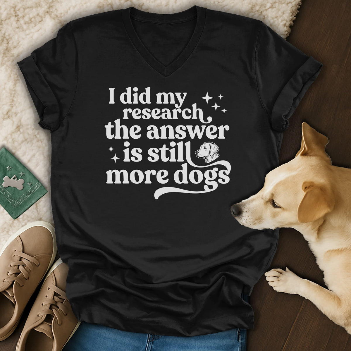 Black v-neck t-shirt with text "I did my research the answer is still more dogs."