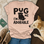 Peach t-shirt with "PUG ME I'M ADORABLE" text and pug graphic.