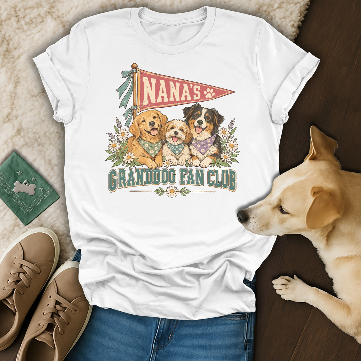White t-shirt with a vintage graphic of three dogs and the text Nana's Granddog Fan Club.