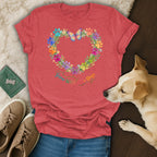 Red t-shirt with floral heart of paw prints, butterfly, and "Grow Wild Love Dogs" text.