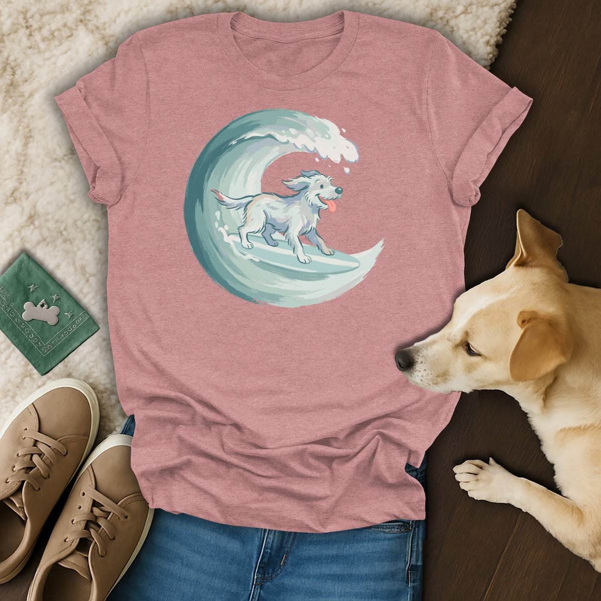 T-shirt with illustration of a dog surfing a stylized wave.