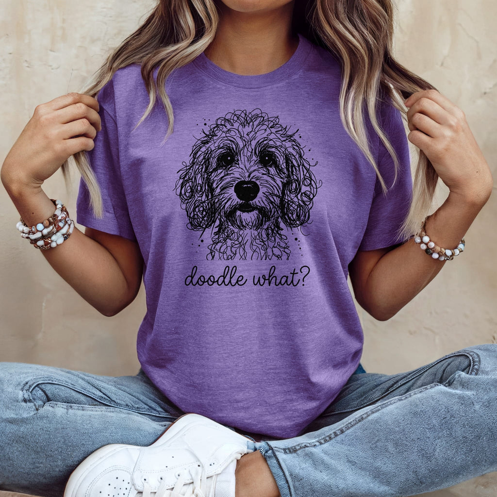 Purple t-shirt with a black doodle-style dog and "doodle what?" text.