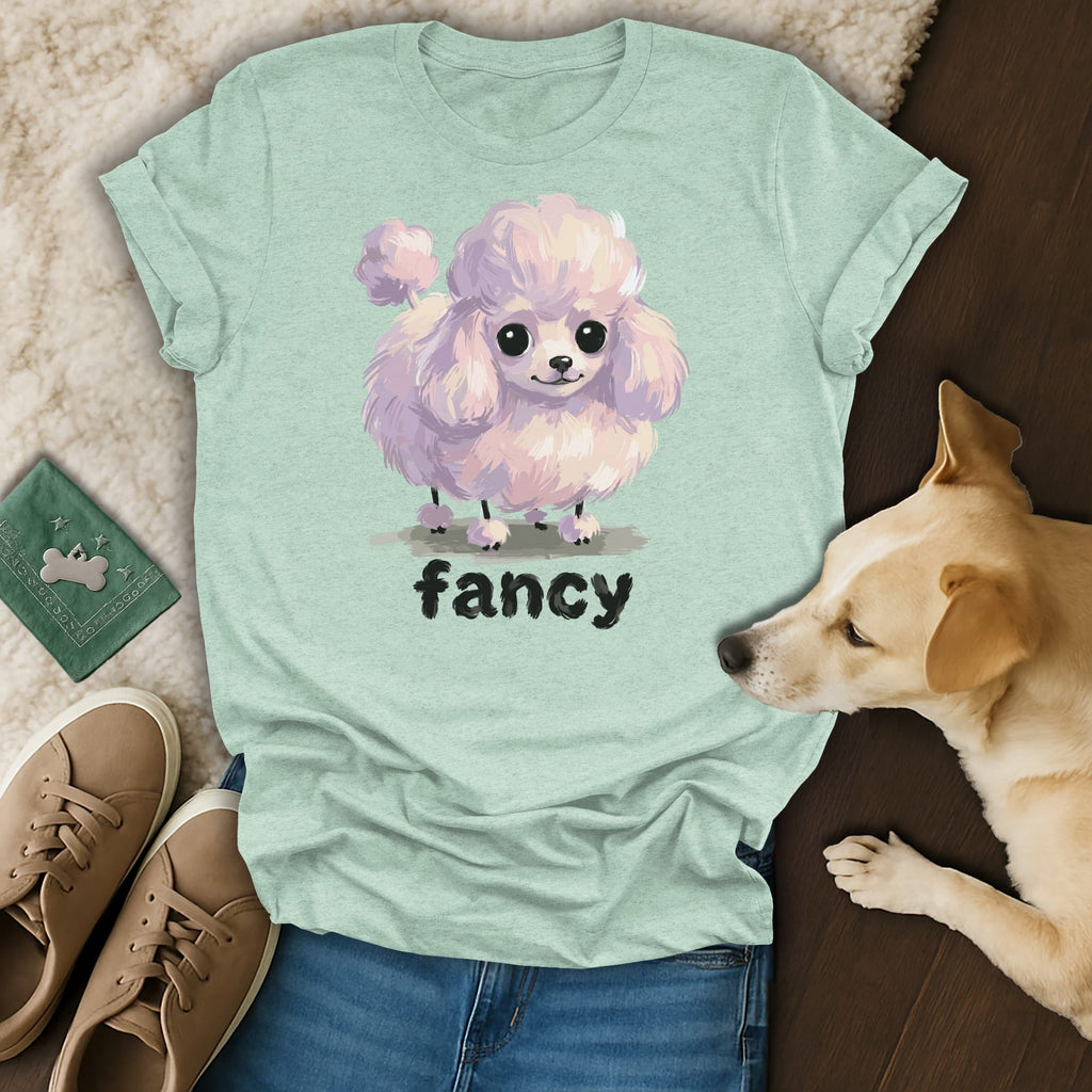 Light mint green t-shirt with a cartoon pink poodle and the word "fancy."