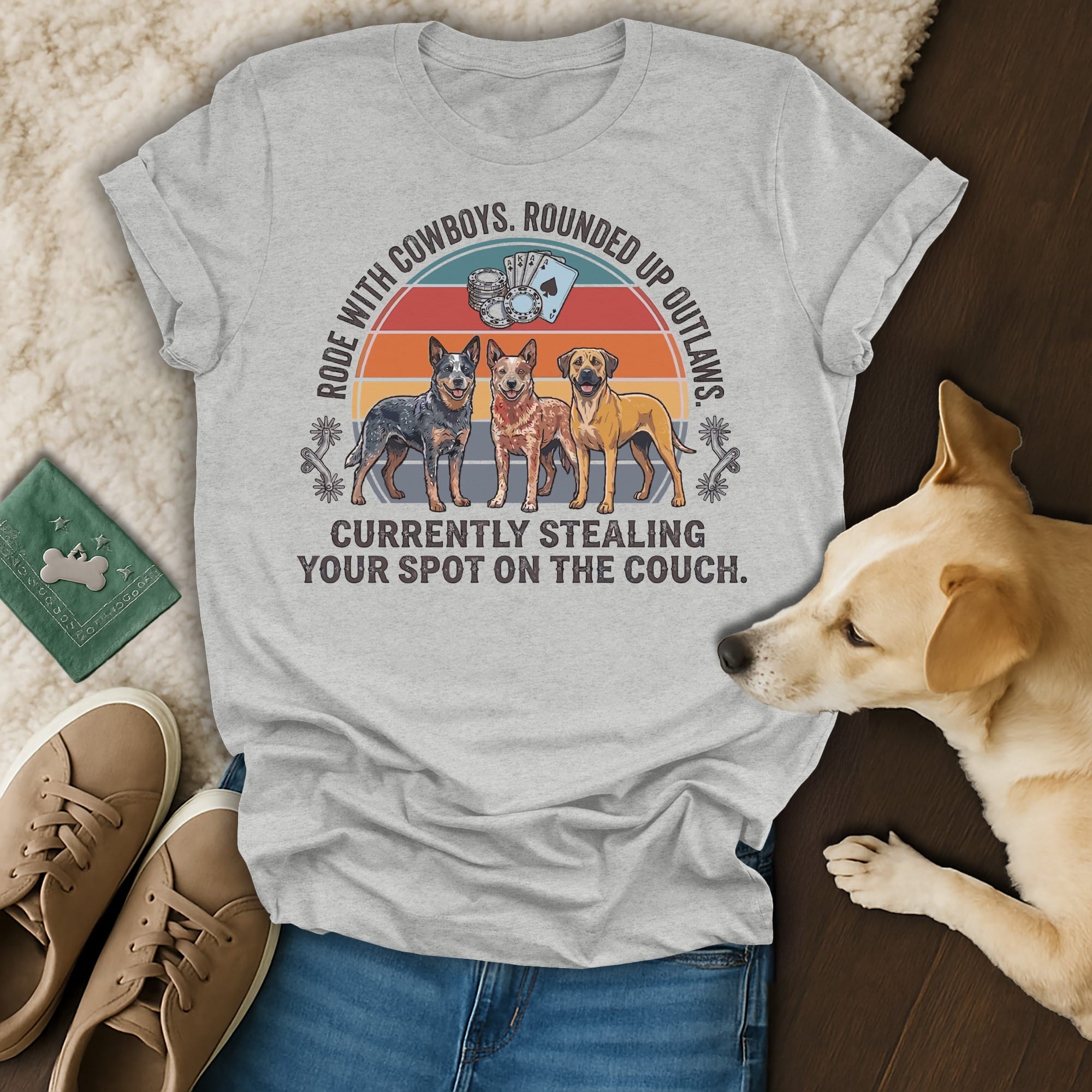 Gray t-shirt with cowboys, dogs, and text about stealing a couch spot.