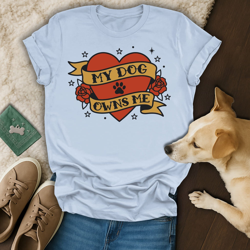 Light blue t-shirt with a red heart tattoo design reading "MY DOG OWNS ME".