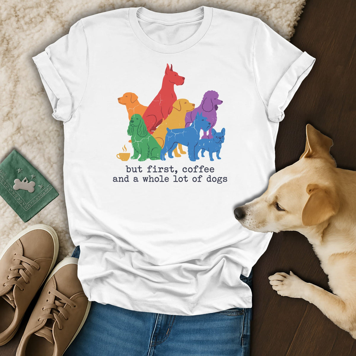 White t-shirt with colorful dog silhouettes and text: "but first, coffee and a whole lot of dogs".