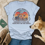 T-shirt with dogs and text "Rode with cowboys. Rounded up outlaws. Currently stealing your spot on the couch."