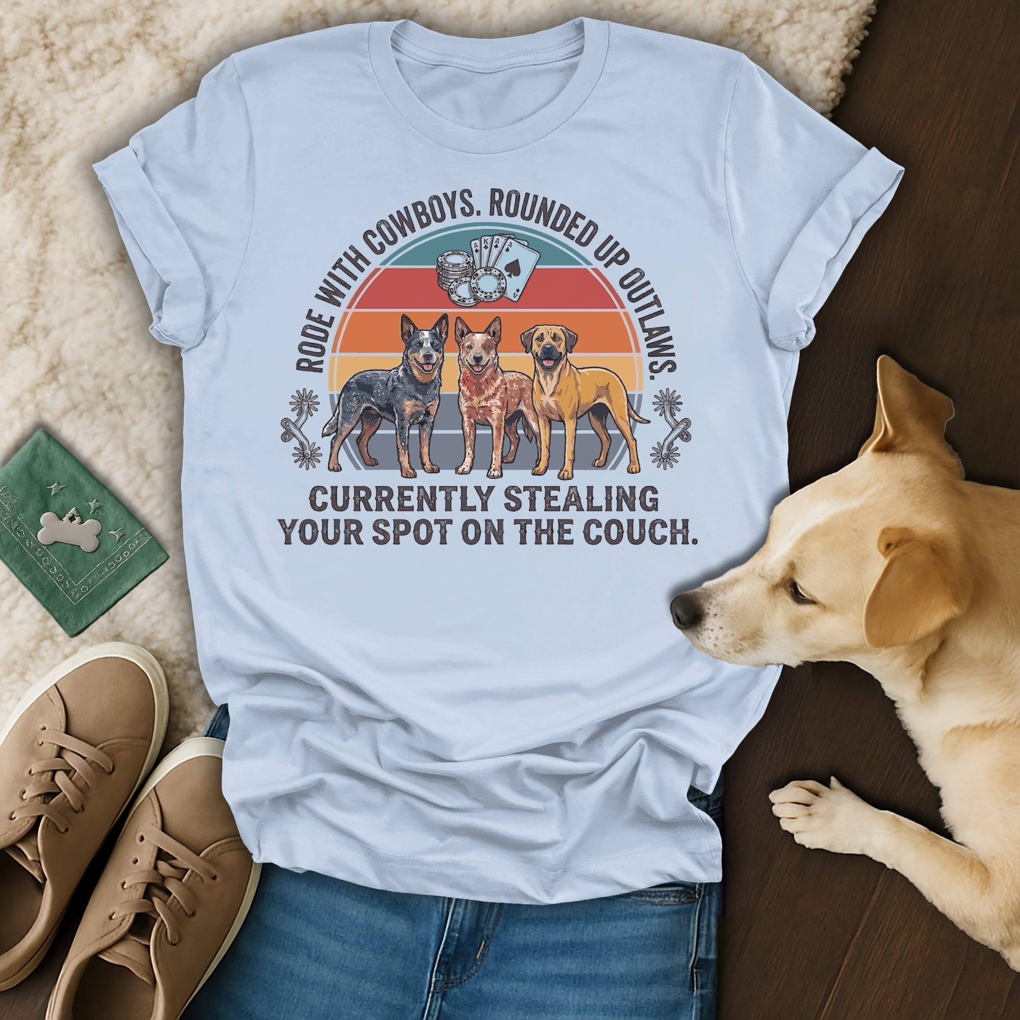T-shirt with dogs and text "Rode with cowboys. Rounded up outlaws. Currently stealing your spot on the couch."